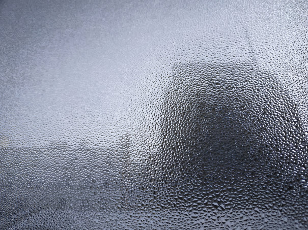 ‘Feeding is Forbidden’ research: city landscape behind waterdrops on a window